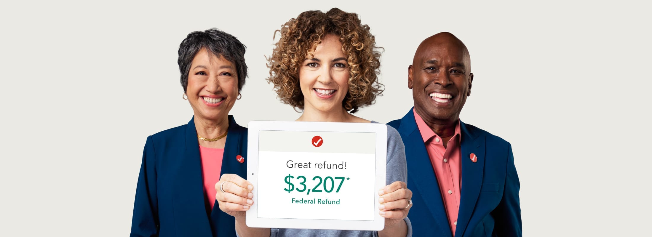 A TurboTax user and two tax experts show off a great refund. 